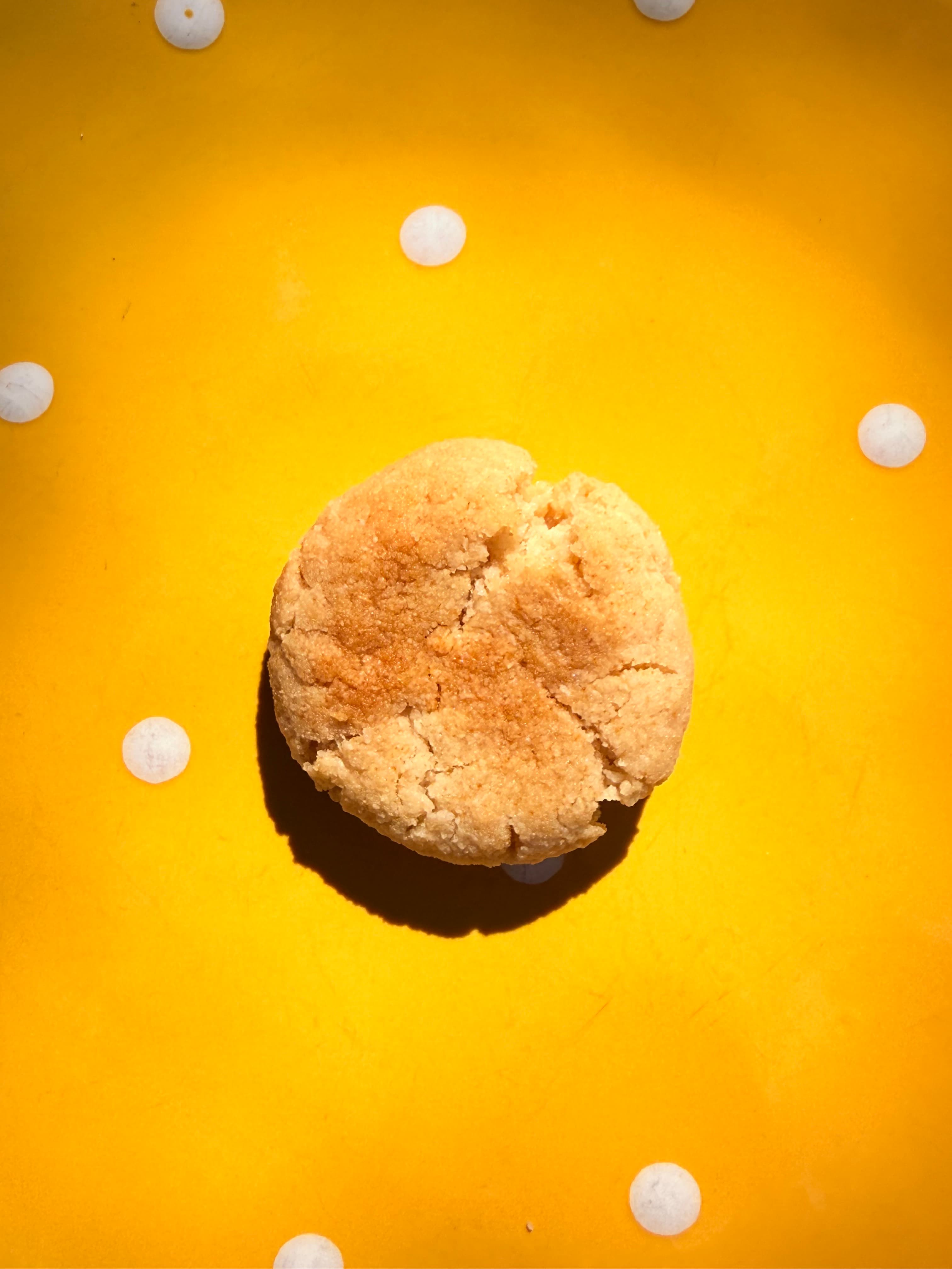 Cookie dough rolled into balls on cream linen